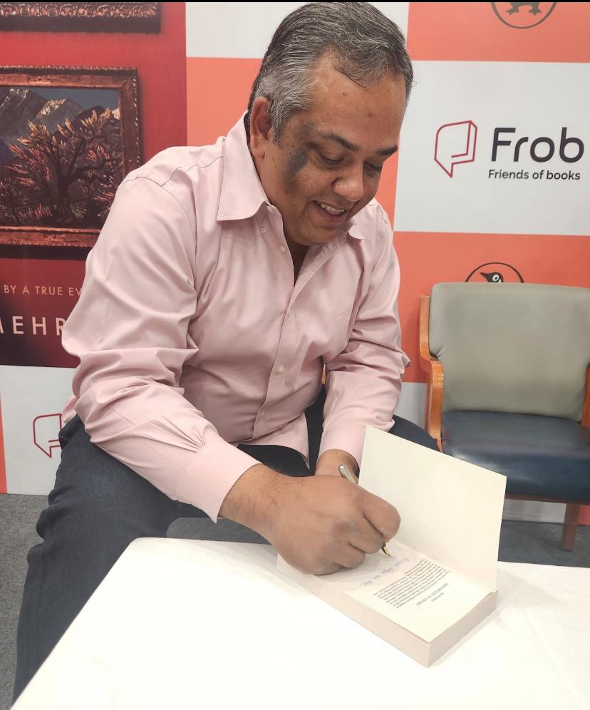 Signing copies and meeting readers